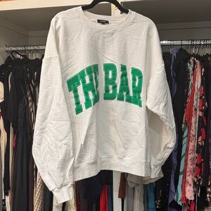The Bar White Sweatshirt with Green Lettering